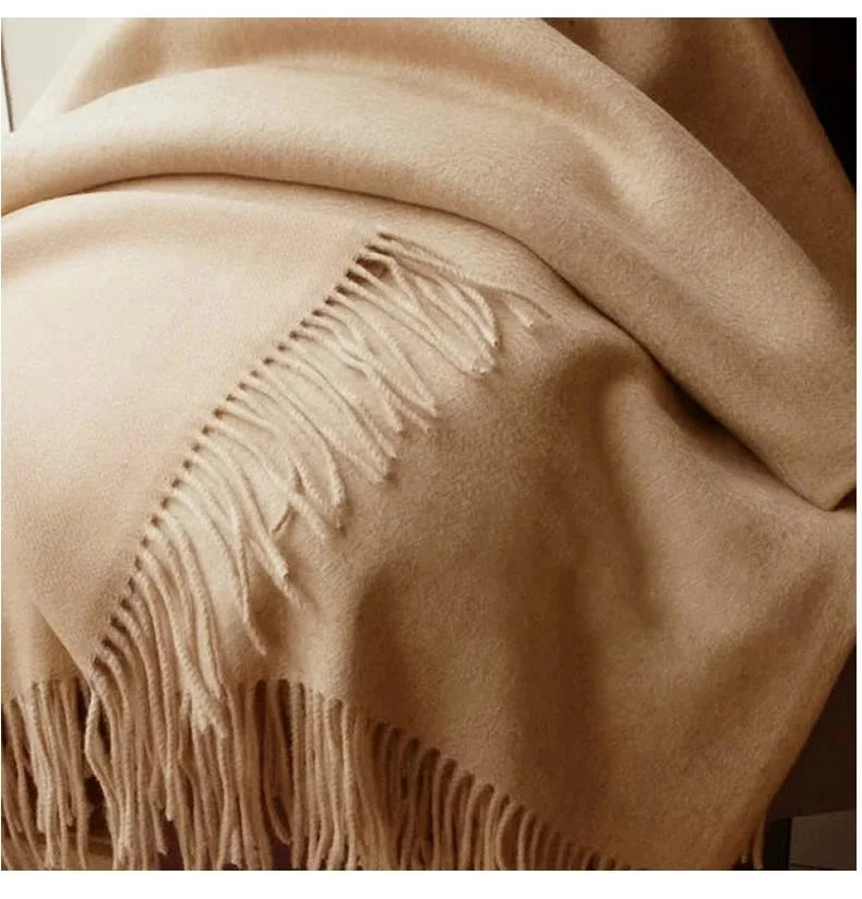 100% wool winter scarf in beige with fringed edge and soft woven texture close-up