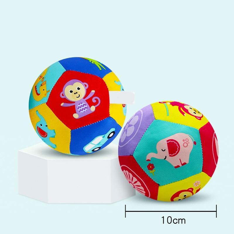 Soft plush animal ball with multicolor animal print; about 10 cm