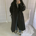 Black long double-breasted overcoat with button details and loose silhouette