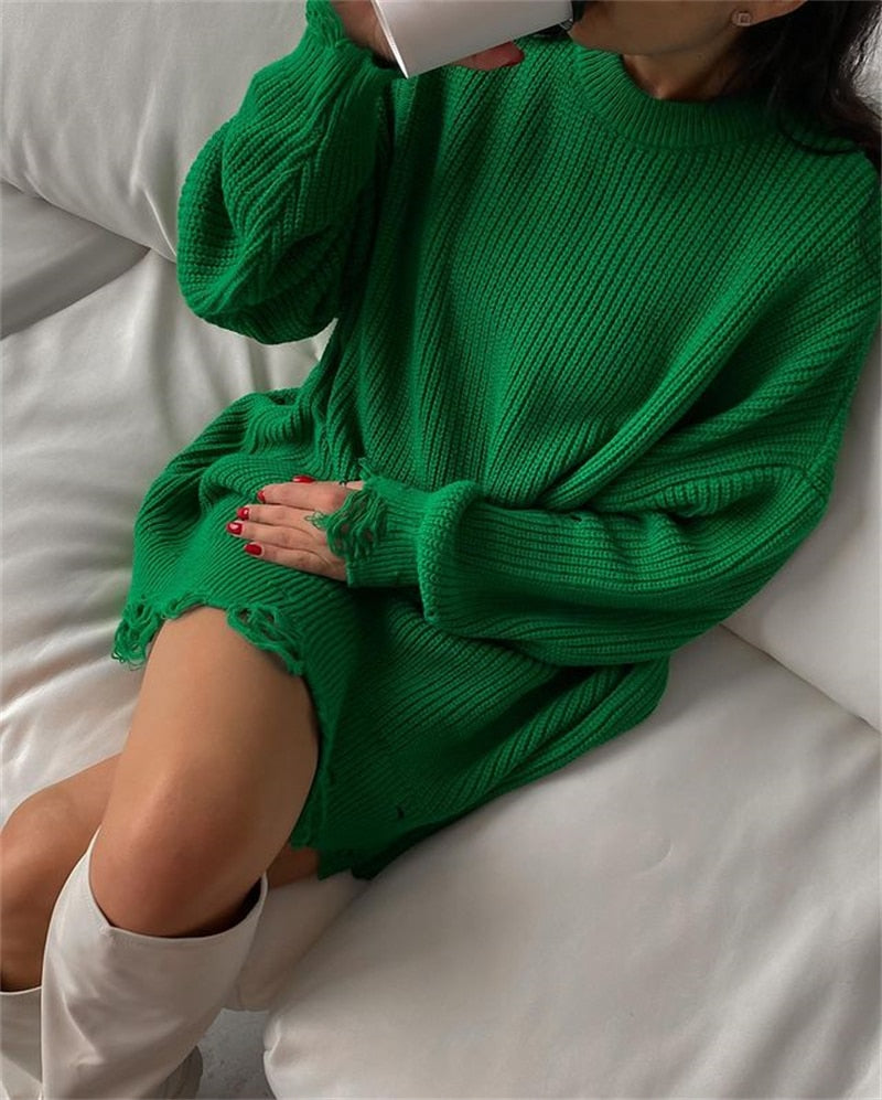Green ribbed knit sweater dress with round neck; loose fit, frayed sleeve cuff and hem