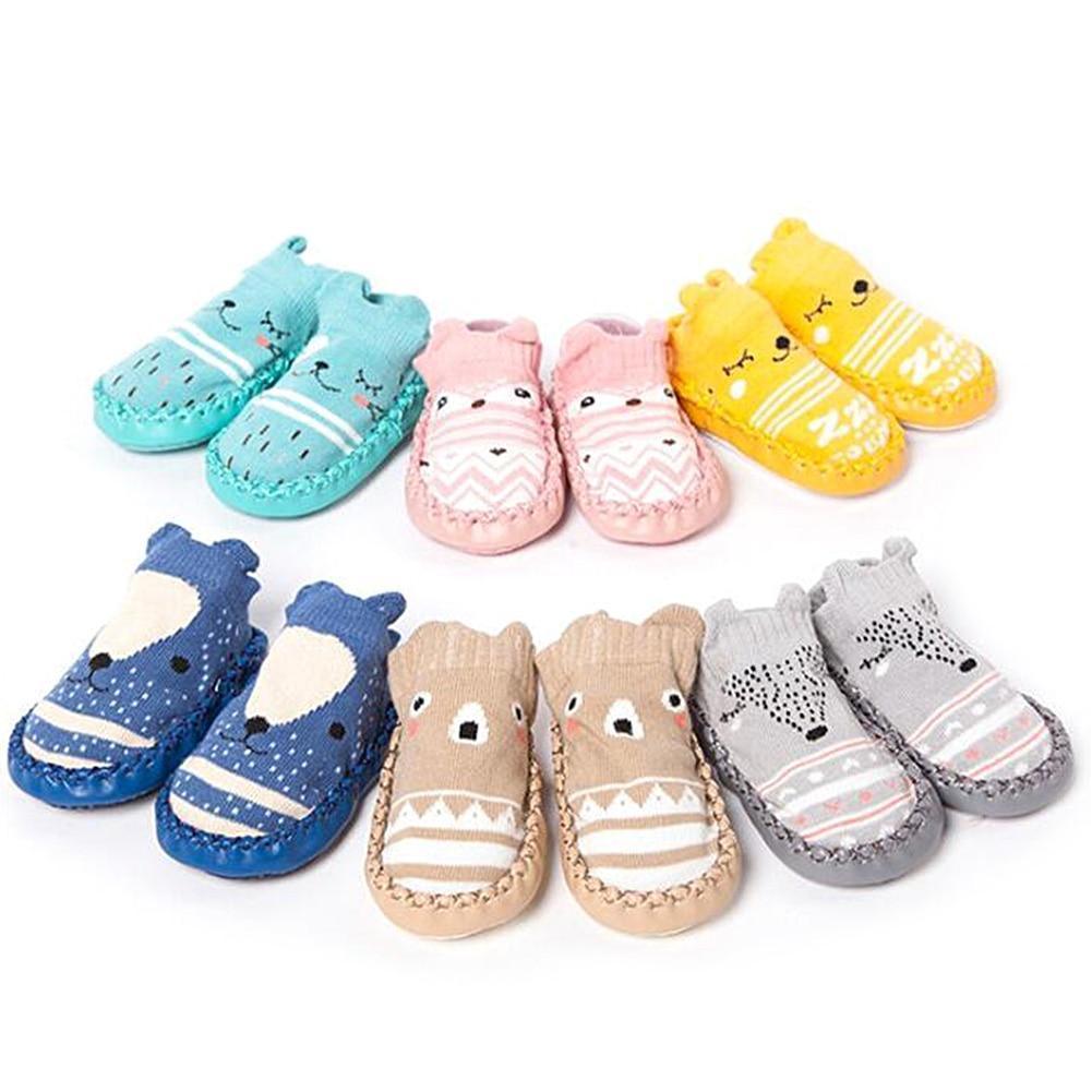Assorted baby cartoon soft-sole socks shoes set in multiple colors, paired