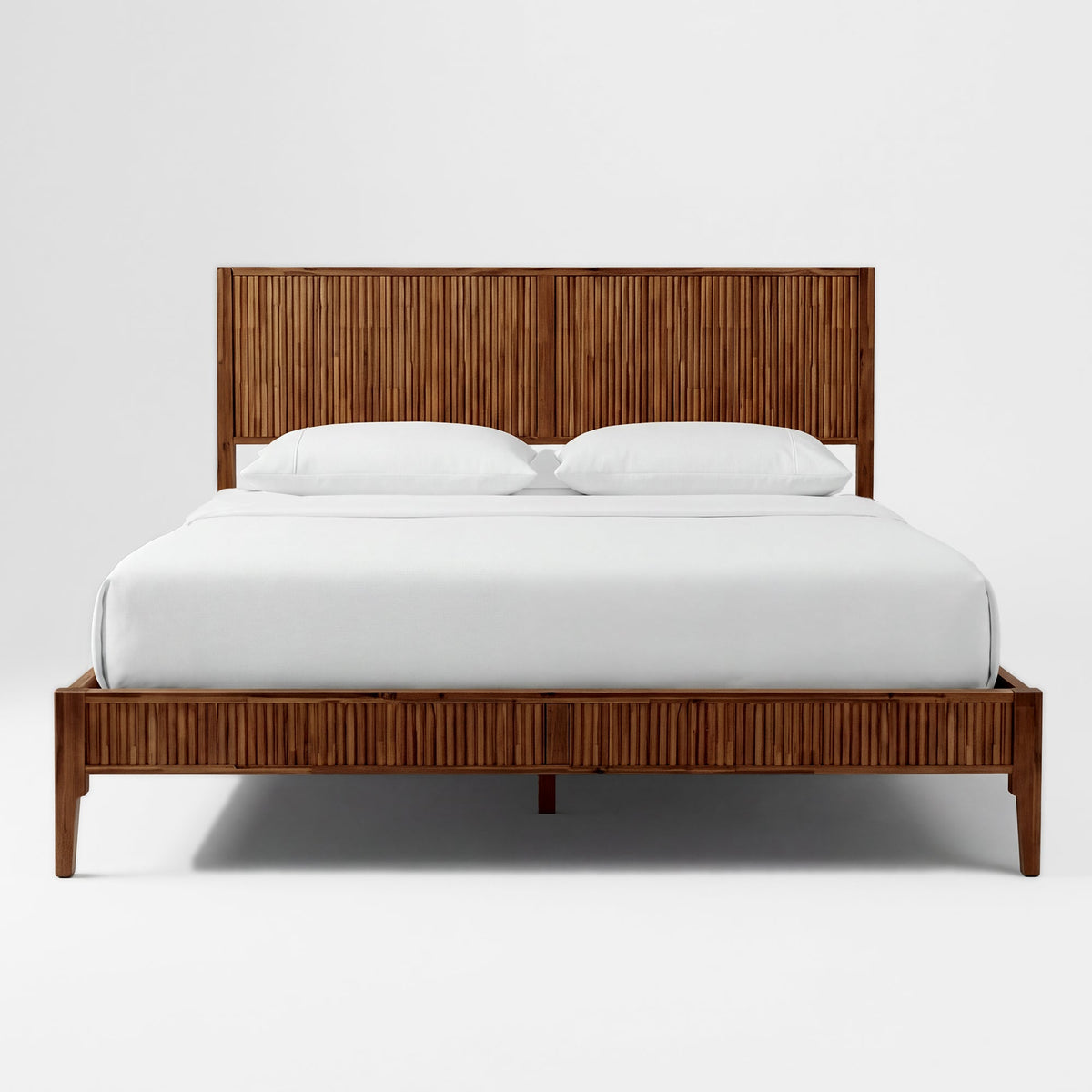Walnut-toned solid wood bed frame with vertical slat headboard and footboard