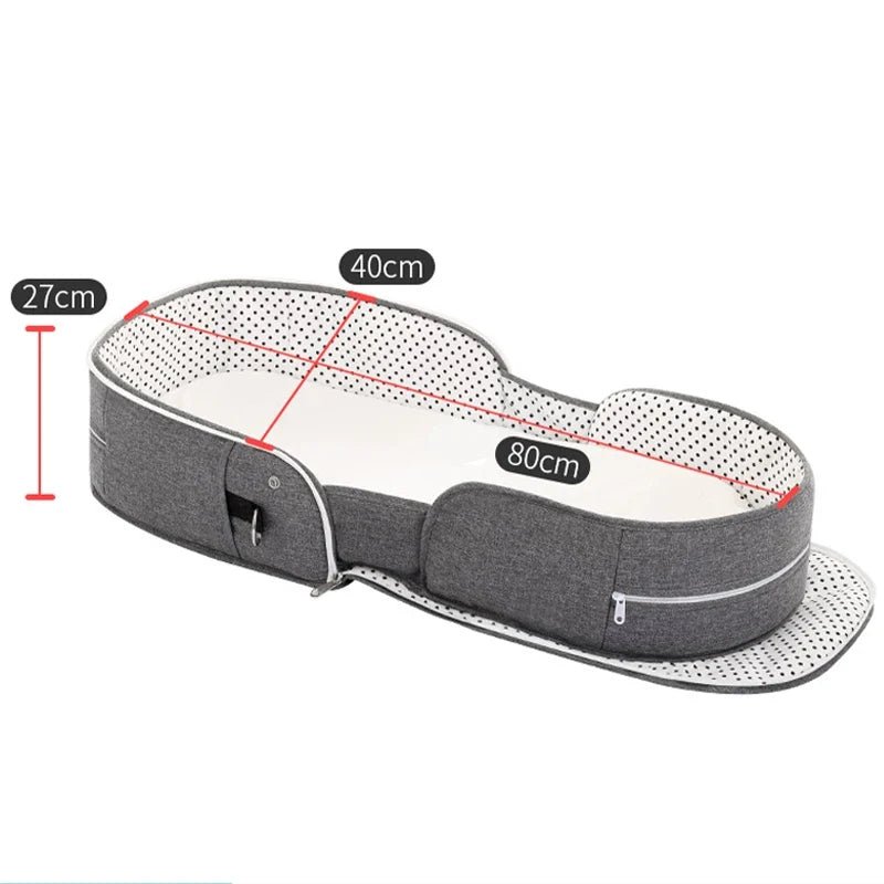 Grey foldable baby cot with white interior mesh and measurements