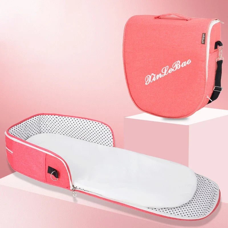 Pink/red foldable baby bassinet with canopy and portable matching carry bag