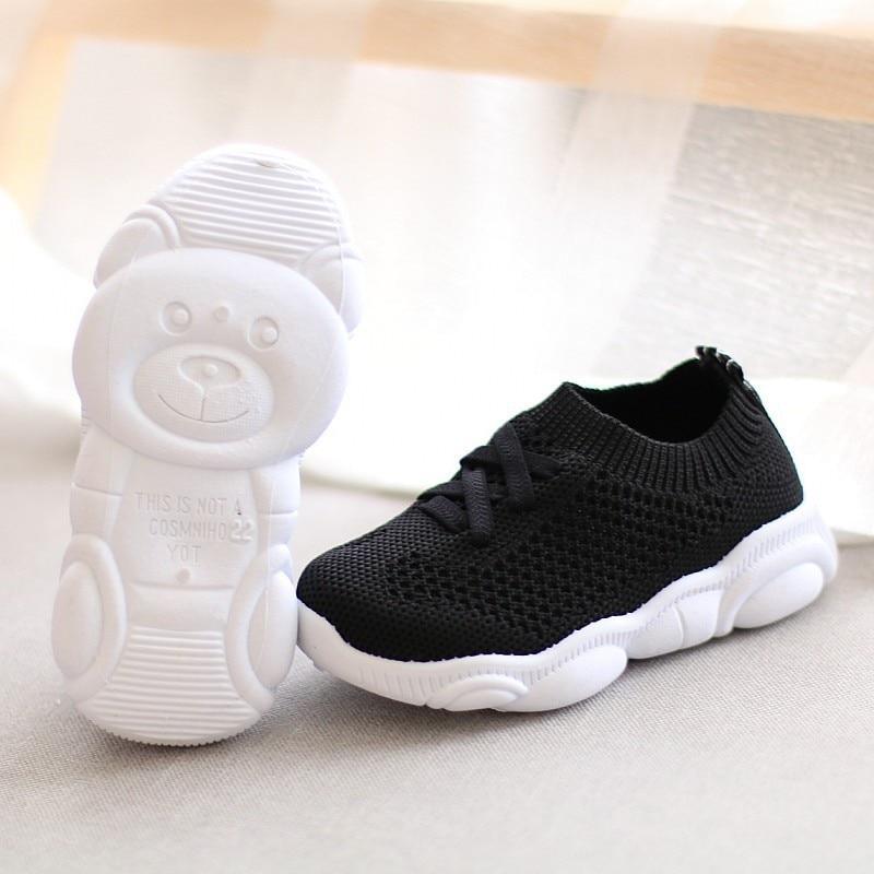 Black and white baby knit sneakers, black upper with white sole
