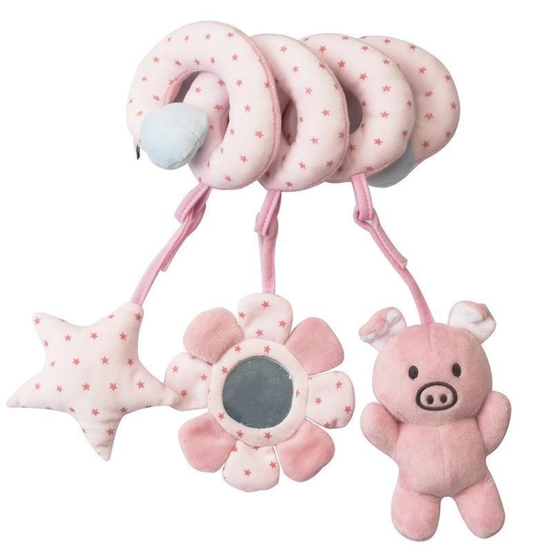 Pink crib spiral rattle toy with flower centerpiece, star toy, and pig plush