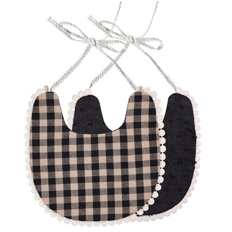 Cotton bib set with black plaid front and solid black back, scalloped pom-pom trim