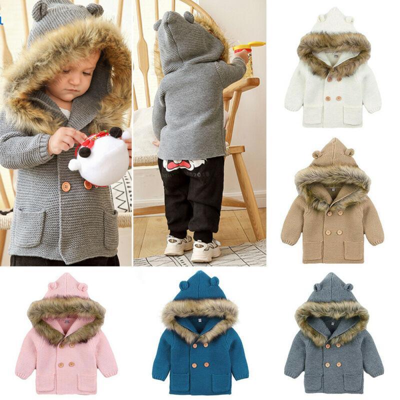 Gray knit hooded baby jacket with faux fur trim and button front