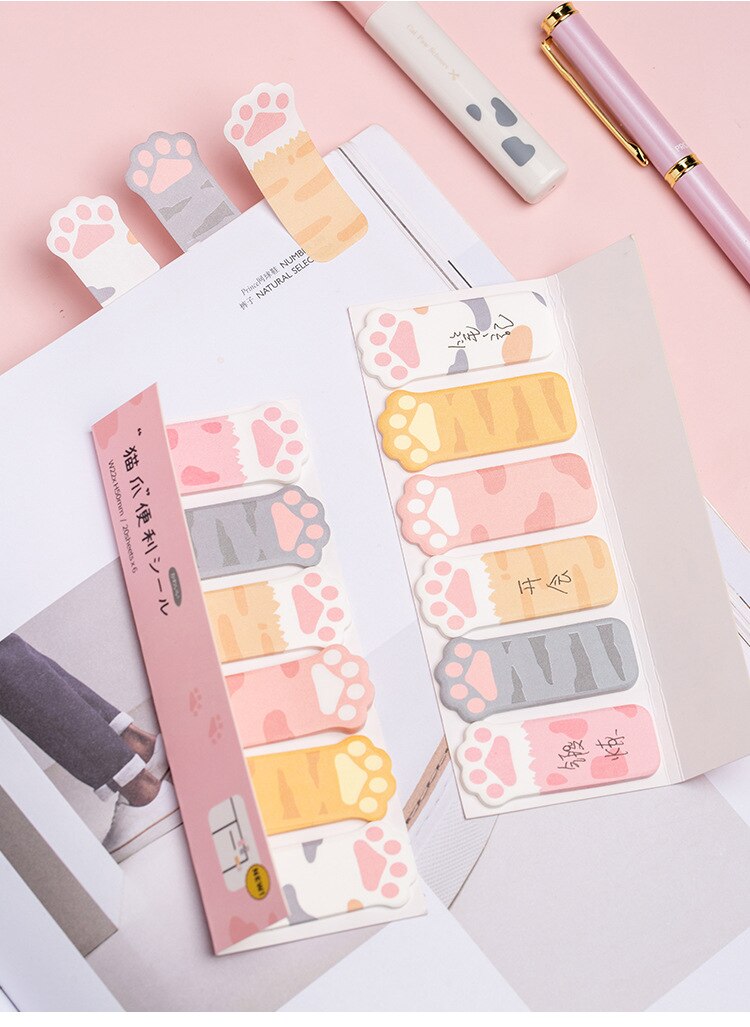 Cat paw sticky note sheets arranged in layers, with pastel paw-print note tabs