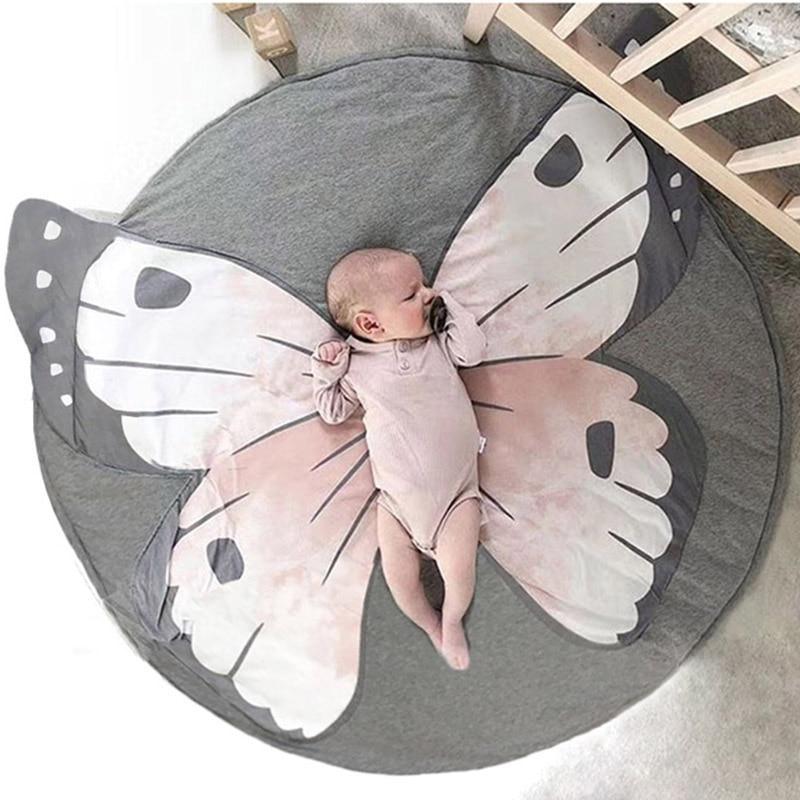 Round baby animal play mat with butterfly animal face pattern, gray and white.