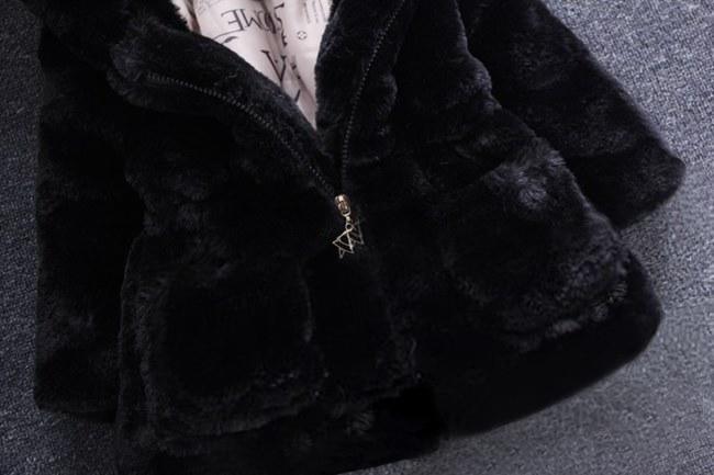 Black hooded plush jacket with front zipper and small chest logo charm