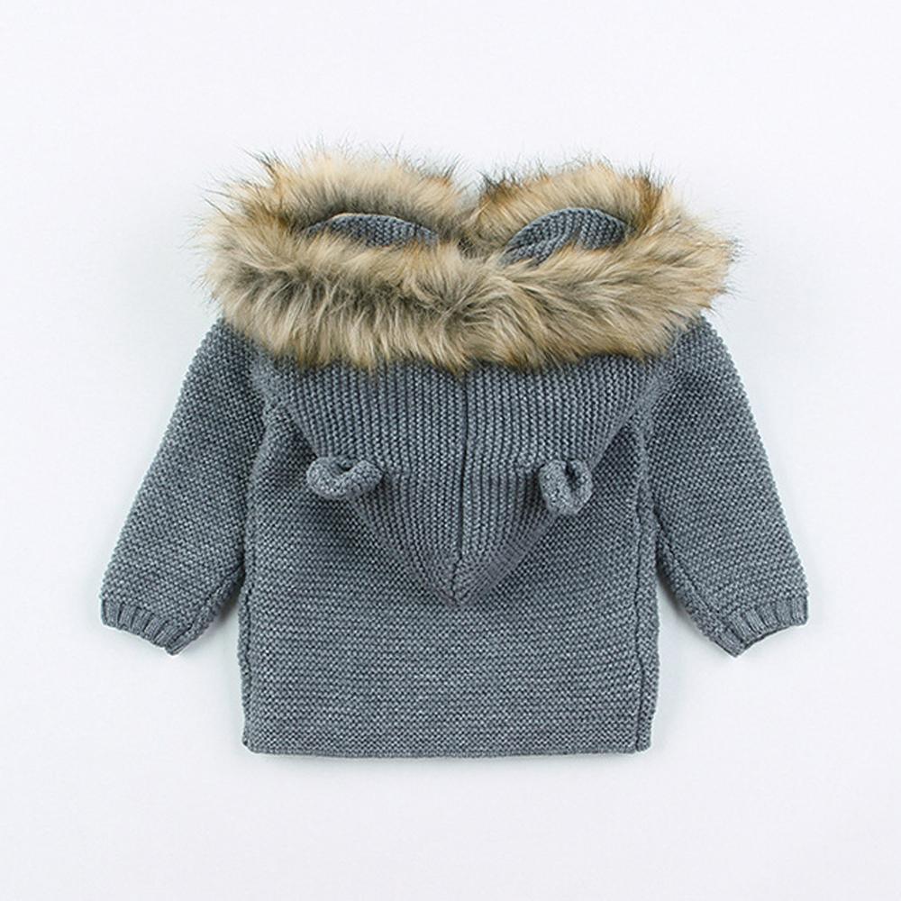 Newborn knitted hooded jacket, dark gray with tan faux-fur hood trim and button closure