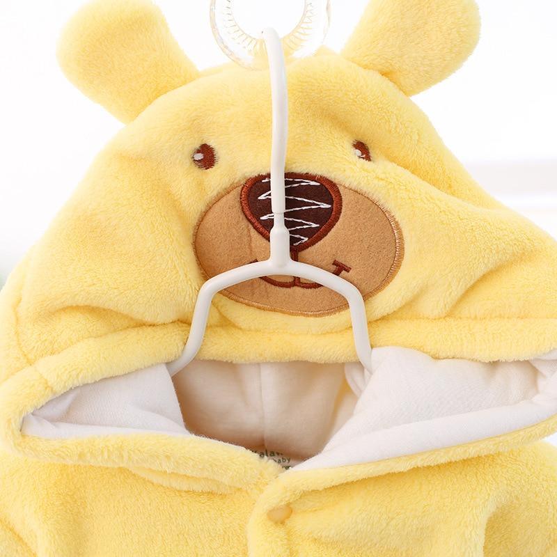 Yellow hooded plush baby romper with bear face patch and paw-sleeve design