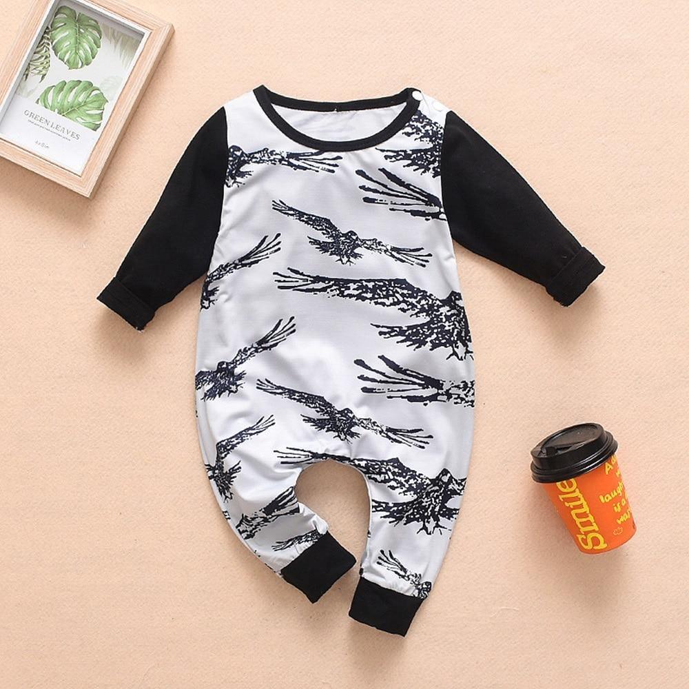 Newborn black-and-white tree silhouette raglan romper with snap legs