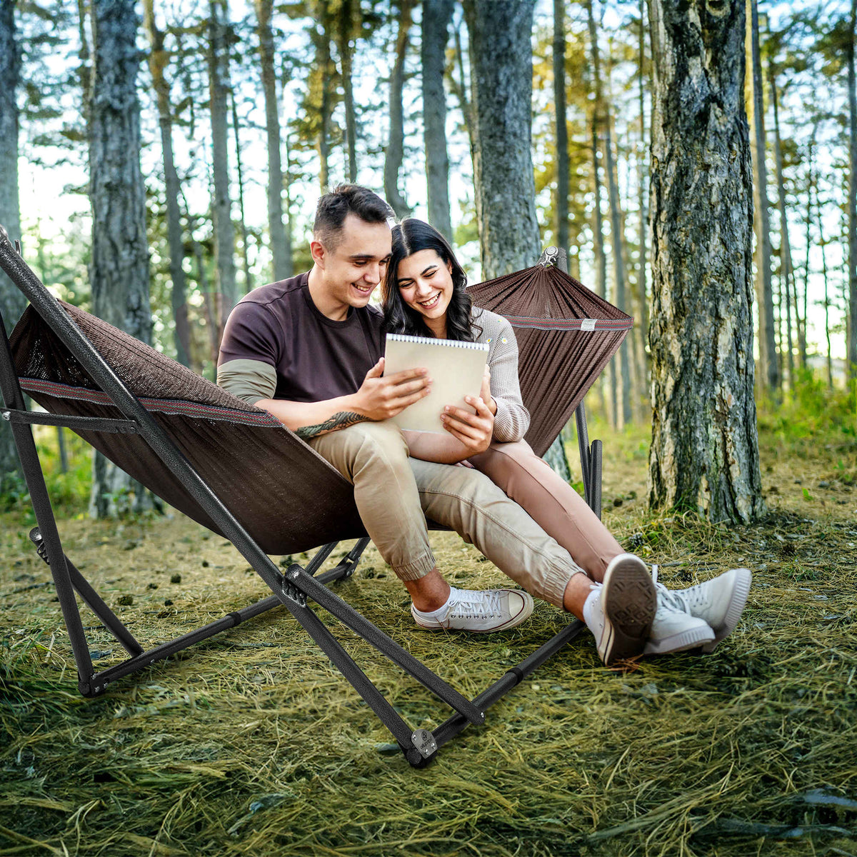 Brown hammock on black folding stand for outdoor lounging