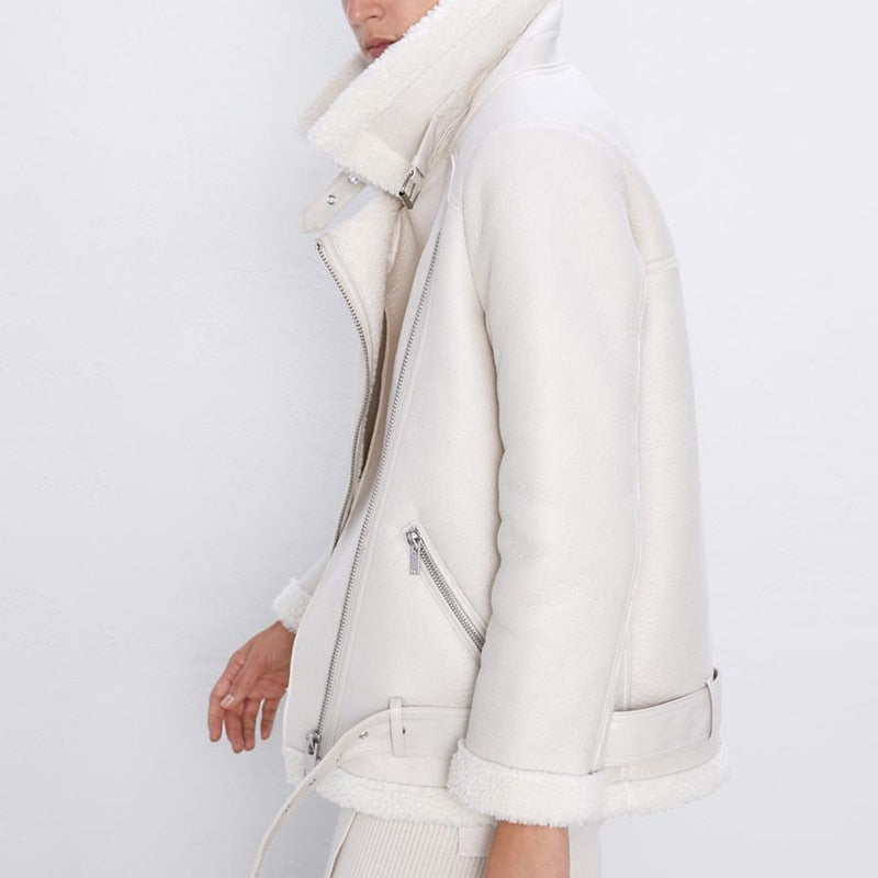 Cream faux lamb leather moto jacket worn, side view with front zip and belt