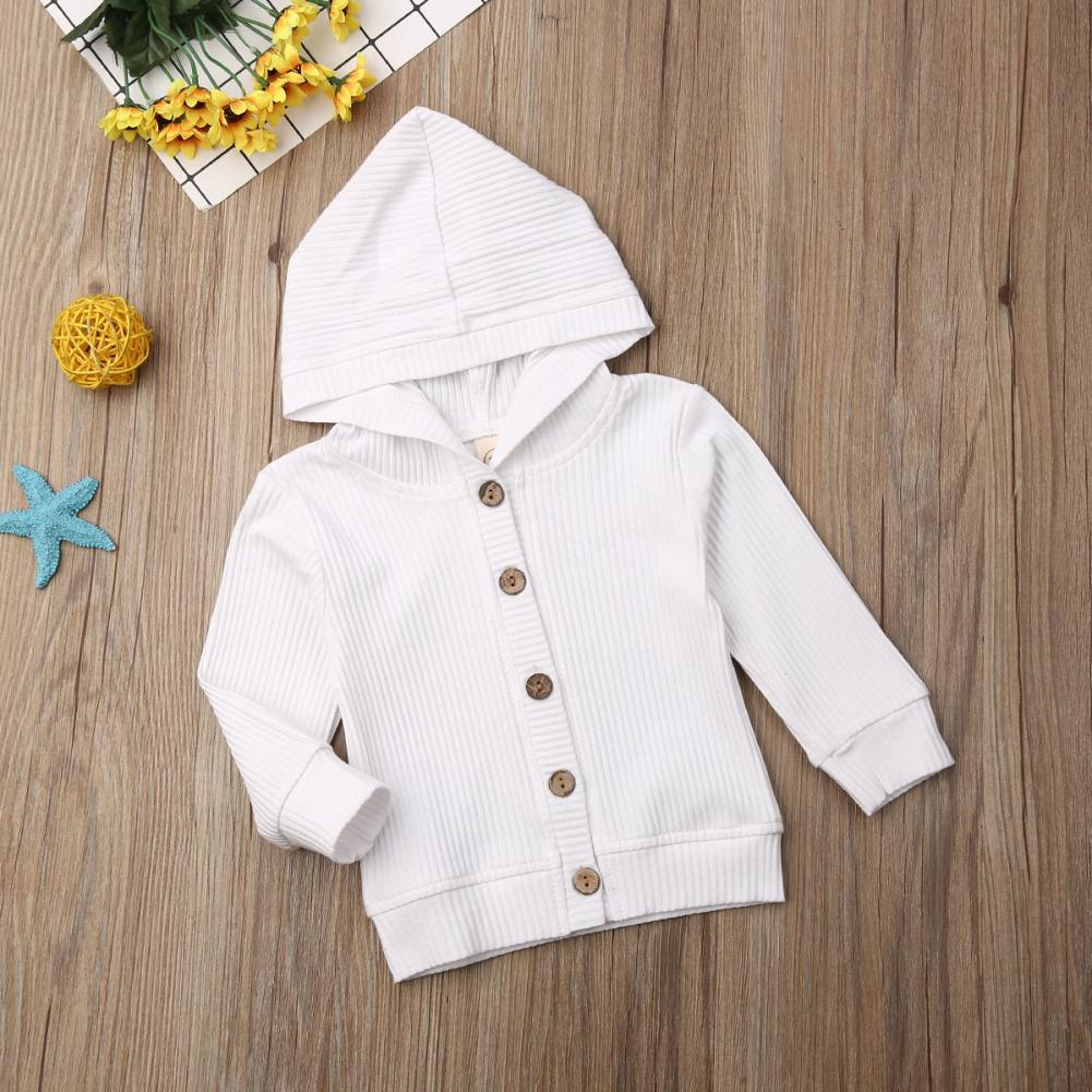 Infant white hooded knit jacket shown from the side, with button front and long sleeves