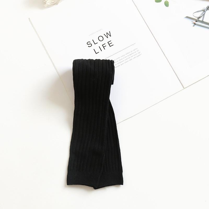 Toddler ribbed knit leggings, solid black folded flat.
