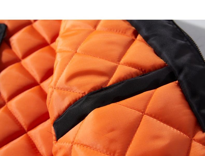 Orange quilted jacket lining detail with stitched channel padding