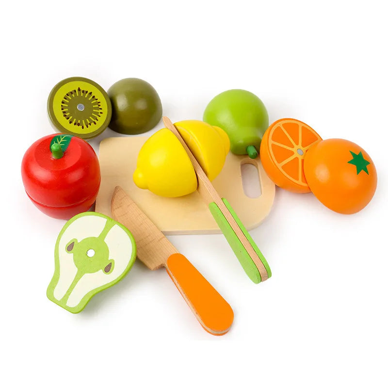 Wooden cutting board with toy fruit halves, vegetable slices, and a wooden knife