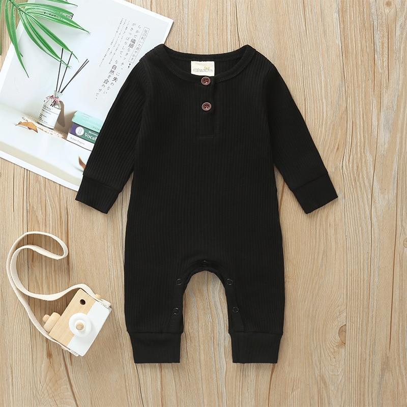Newborn long-sleeve ribbed romper in black with three-button henley neckline