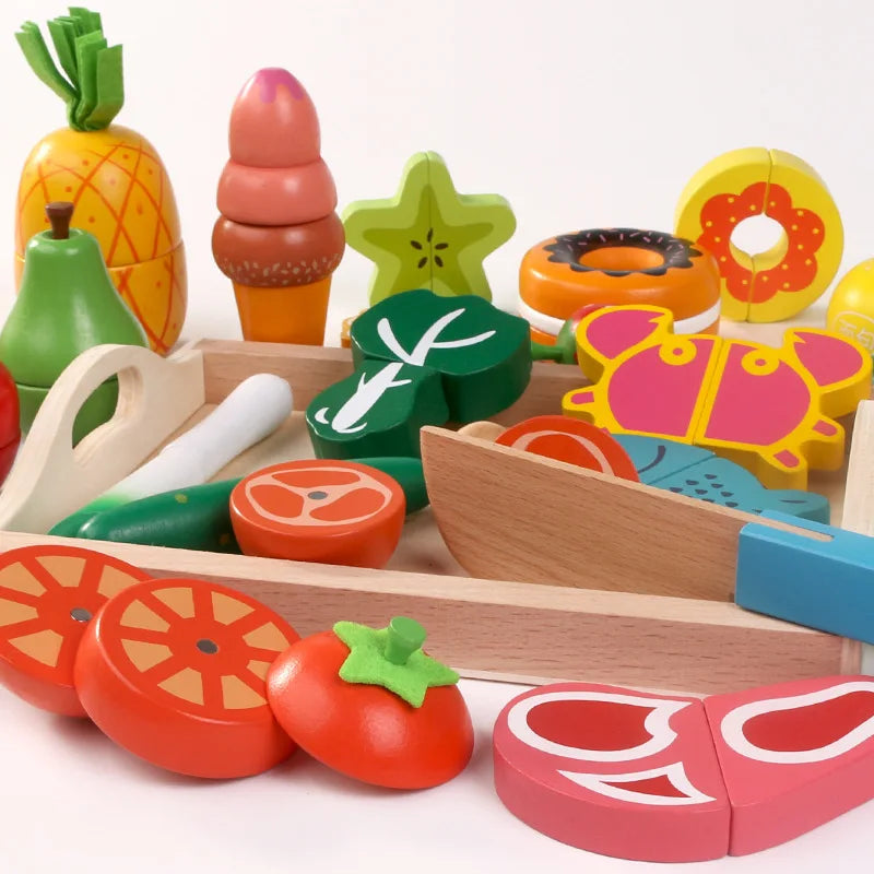 Assorted colorful toy fruit and vegetable pieces with a wooden cutting board and knife