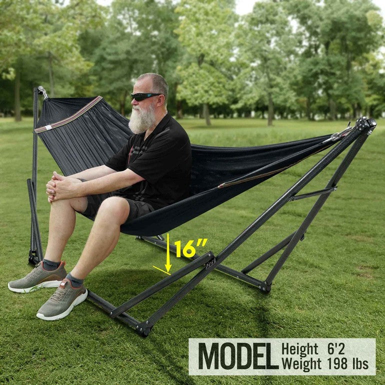 Black hammock on a metal stand with striped trim and stable legs