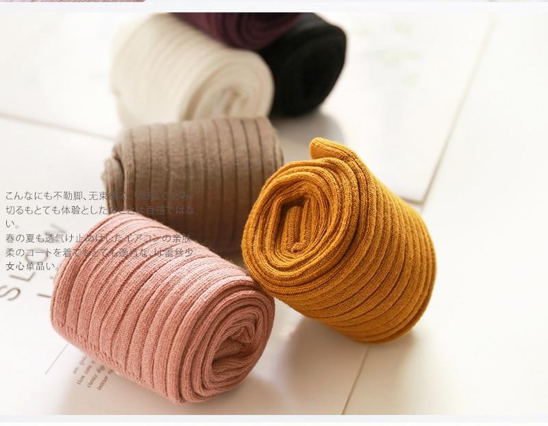 Ribbed knit toddler leggings, rolled assorted colors including pink and mustard.