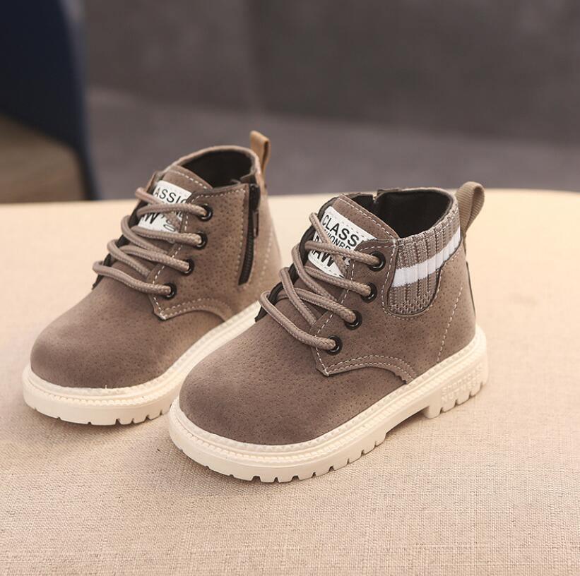 Kids suede winter boots in brown with lace-up front, side elastic panel, and white sole
