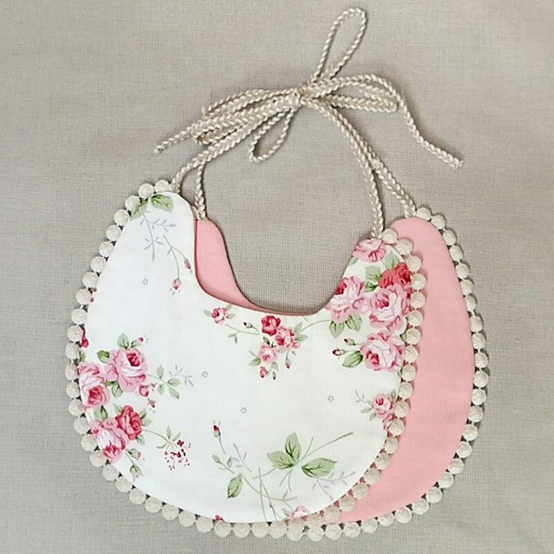 Infant bandana bib set with floral white front, pink back, beaded trim