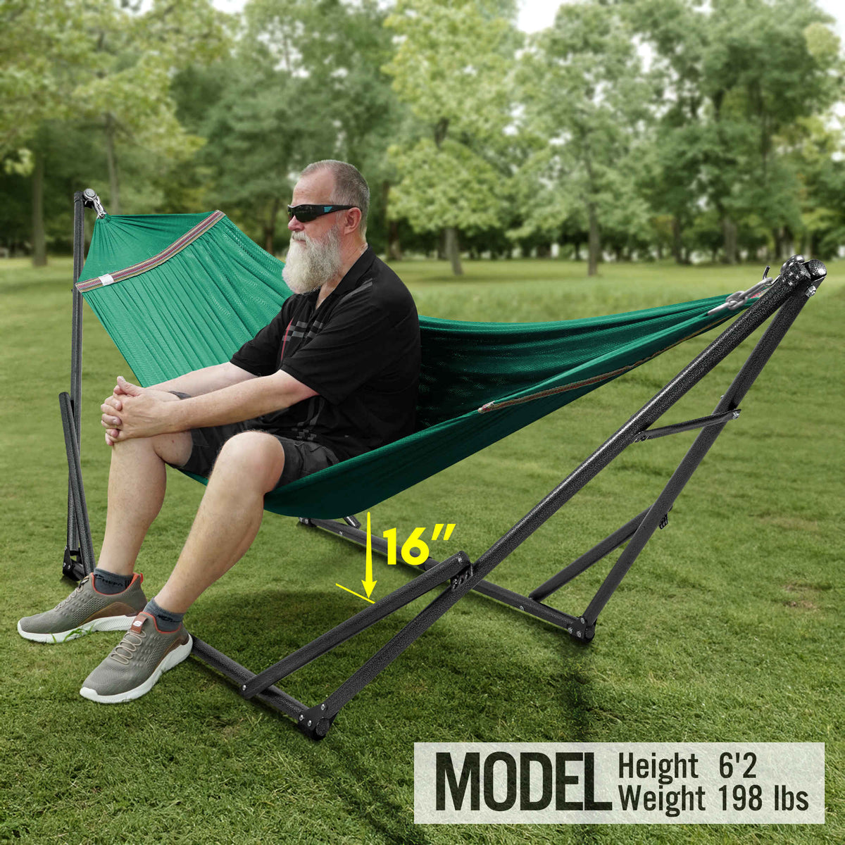 Teal hammock with black stand, seated person relaxing on outdoor lawn