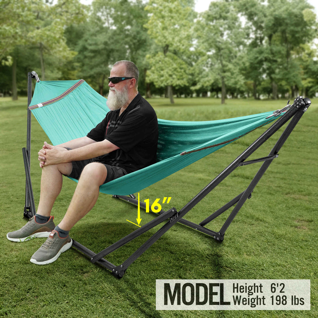 Teal hammock with black folding stand, stretched between two adjustable end frames