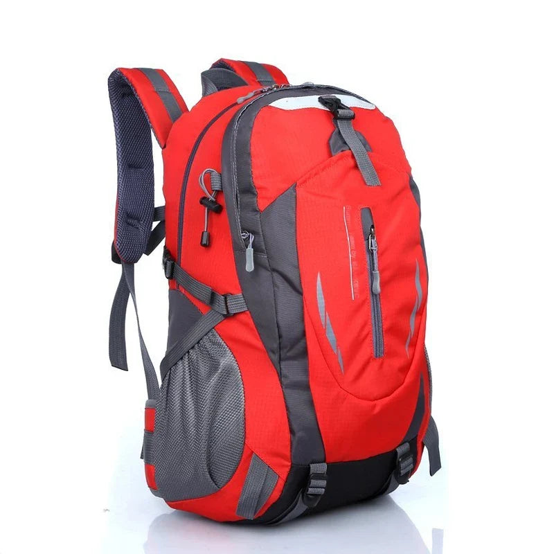Water-resistant hiking backpack in red and dark gray with front zip pockets and padded shoulder straps
