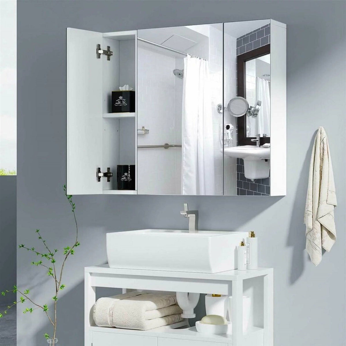 Wall-mounted medicine cabinet with mirrored doors and built-in side shelves