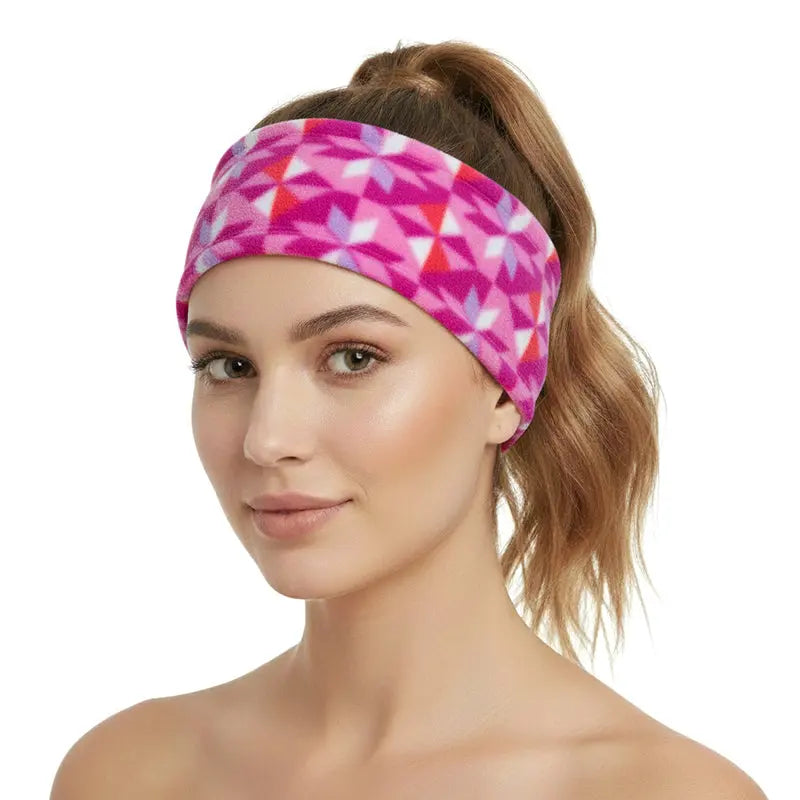 Pink geometric fleece headband worn, wide soft coverage