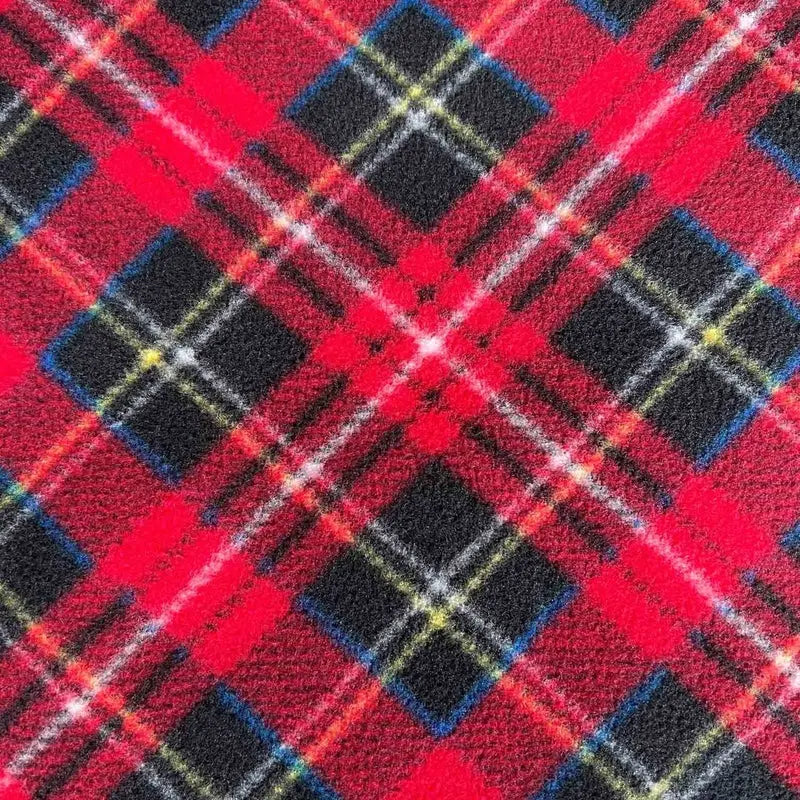 Fleece sock fabric close-up in red plaid with navy and yellow grid lines