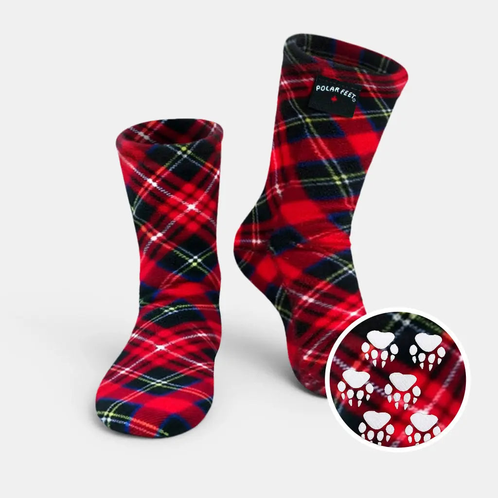 Kids' nonskid fleece socks in red and navy plaid with paw-print grip