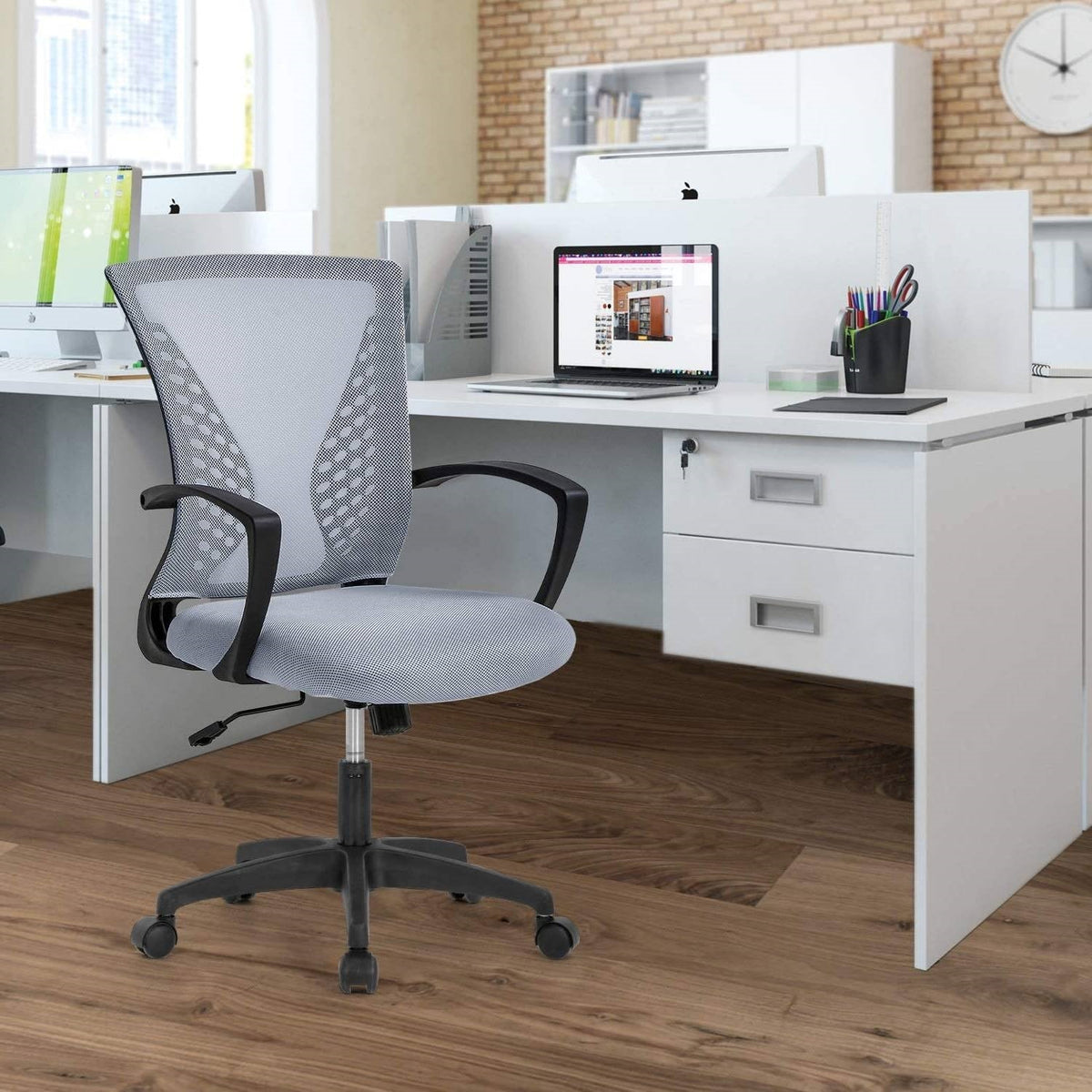 Gray mesh mid-back desk chair with armrests, padded seat, and rolling caster base