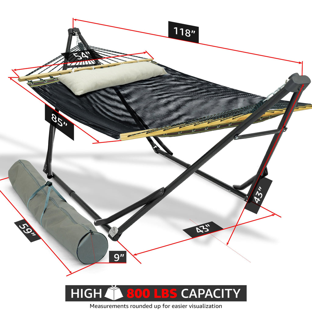 Dark hammock bed on black stand with beige head pillow and yellow edge fabric