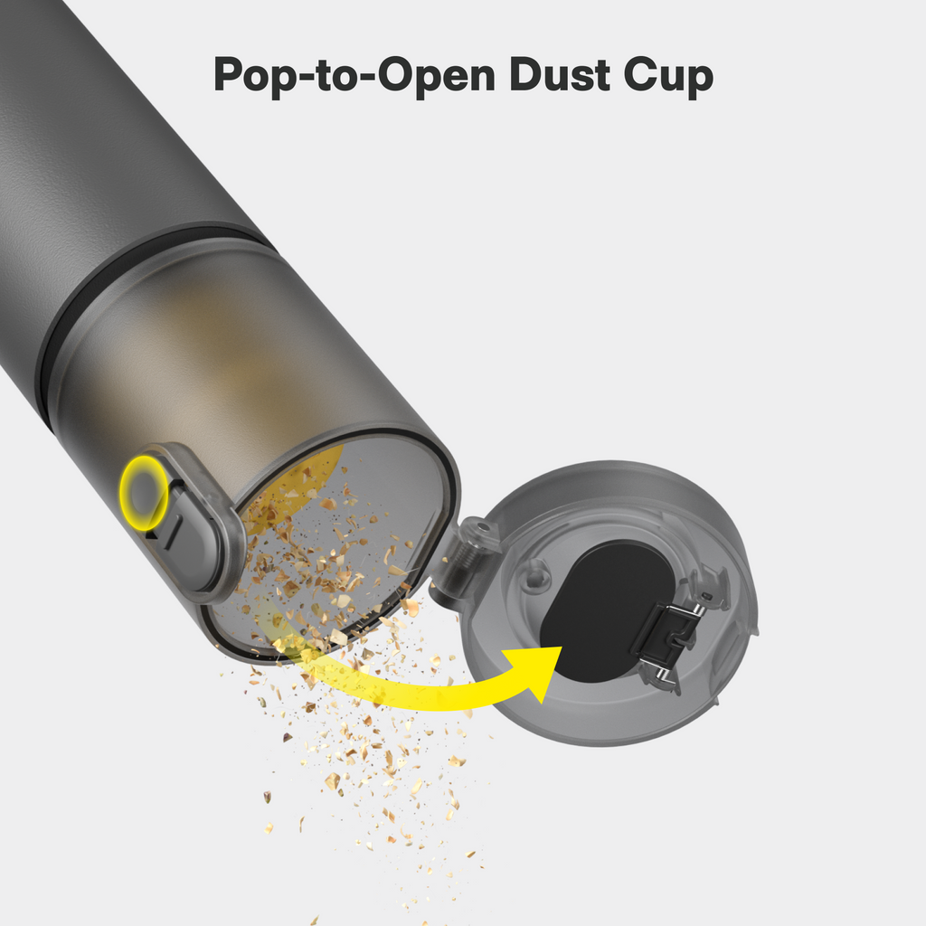Handheld vacuum duster with open dust cup, showing the emptying chamber