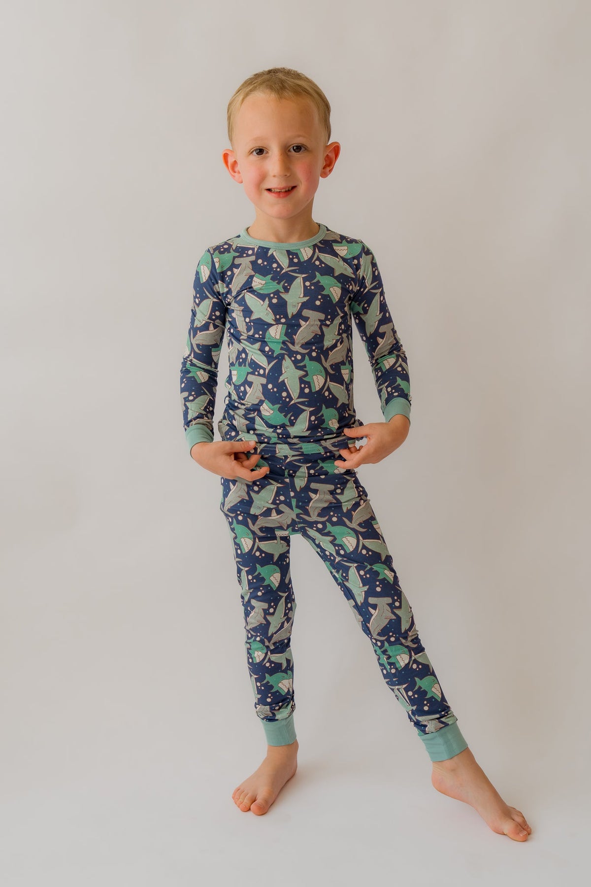Blue 2-piece pajama set with long sleeves and ankle pants, shark print