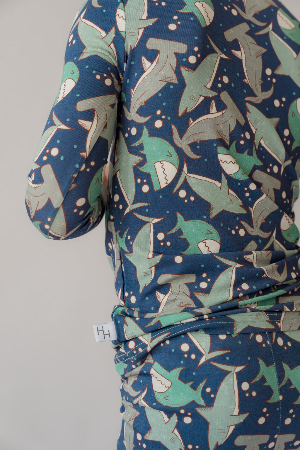 Blue long-sleeve pajama top and matching pants with all-over shark pattern