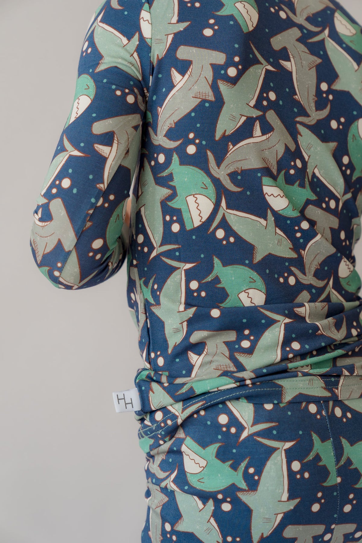 Blue long-sleeve pajama top and matching pants with all-over shark pattern