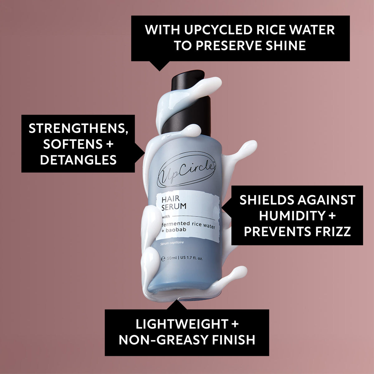 Hair serum bottle with black pump cap and light blue label