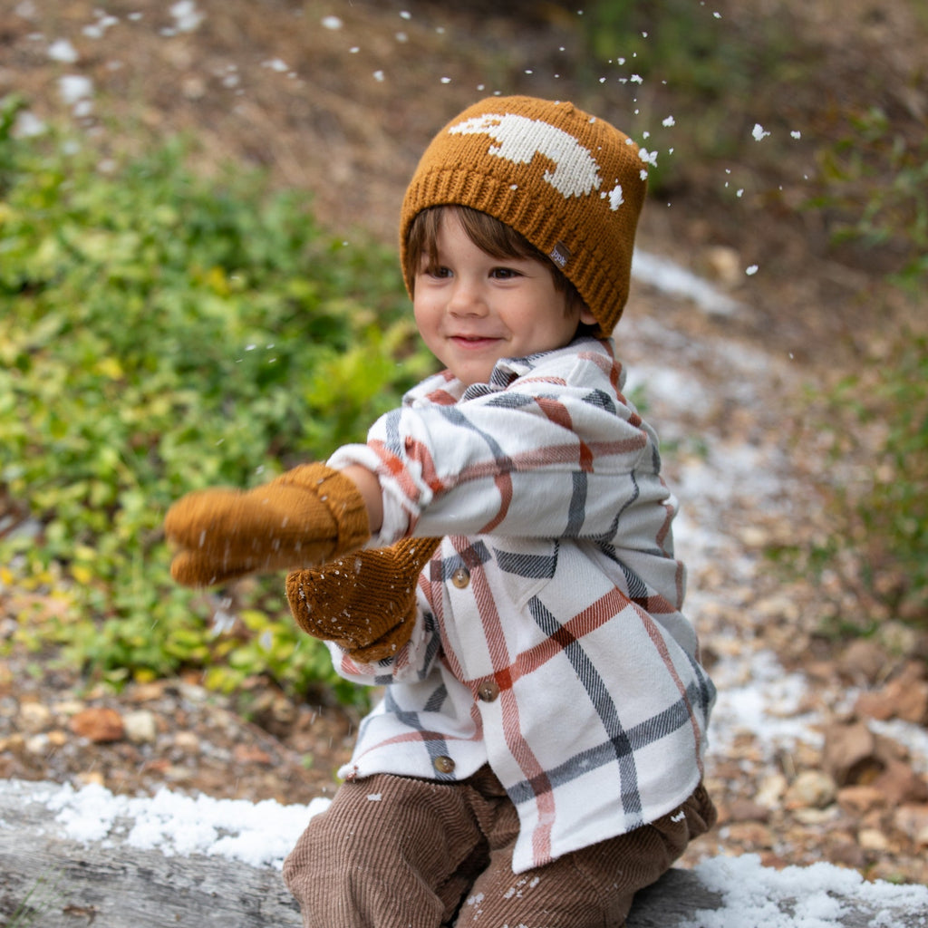 Boys brown knit beanie and mittens set on child outdoors