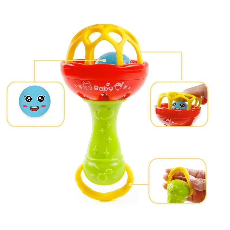 Baby plastic hand rattle with orange bowl and green base