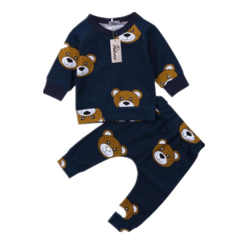 Navy toddler pajama set with long-sleeve top and bear face prints, matching pants