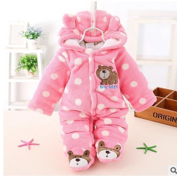 Pink hooded plush baby romper with polka dots, bear chest patch, and character booties
