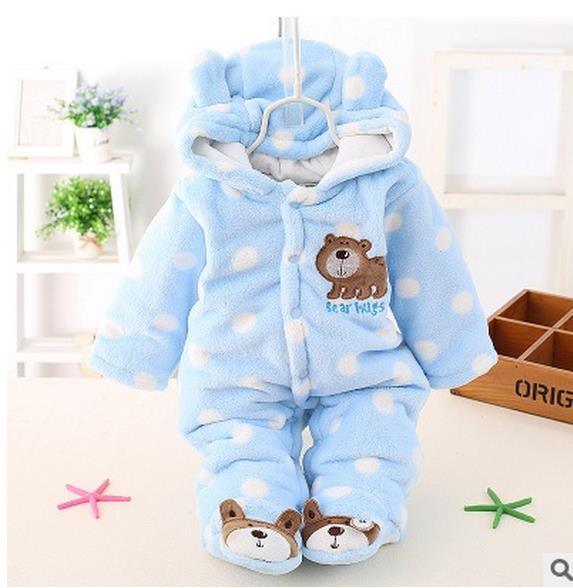 Light blue hooded plush baby romper with polka dots, bear chest patch, and booties