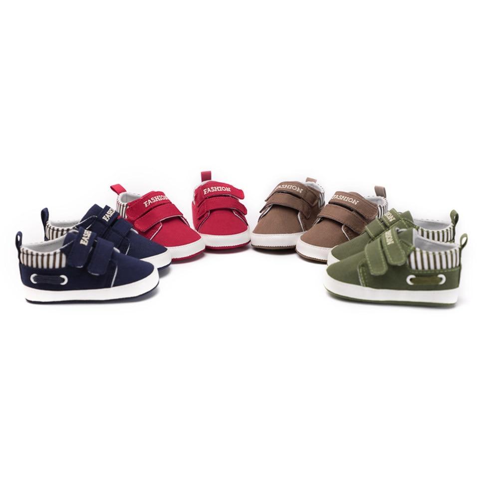 Multi-color infant canvas sneakers assortment in navy, red, brown, and green